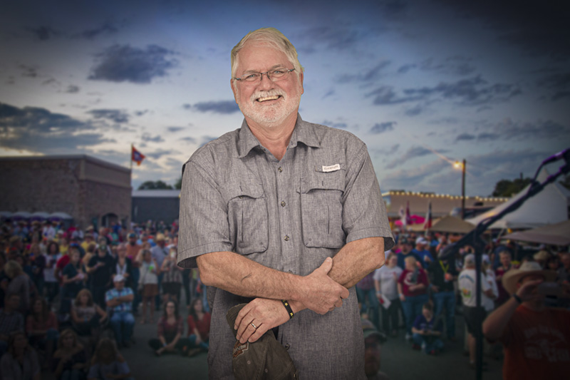 Professional headshot of an adult man with a friendly expression, photographed outdoors or indoors.