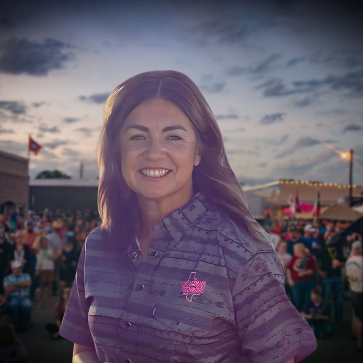 Christie Beyer, Board Member at Bacon Bash Texas with ABF Packing, smiling in a pink blouse at the lively festival gathering.