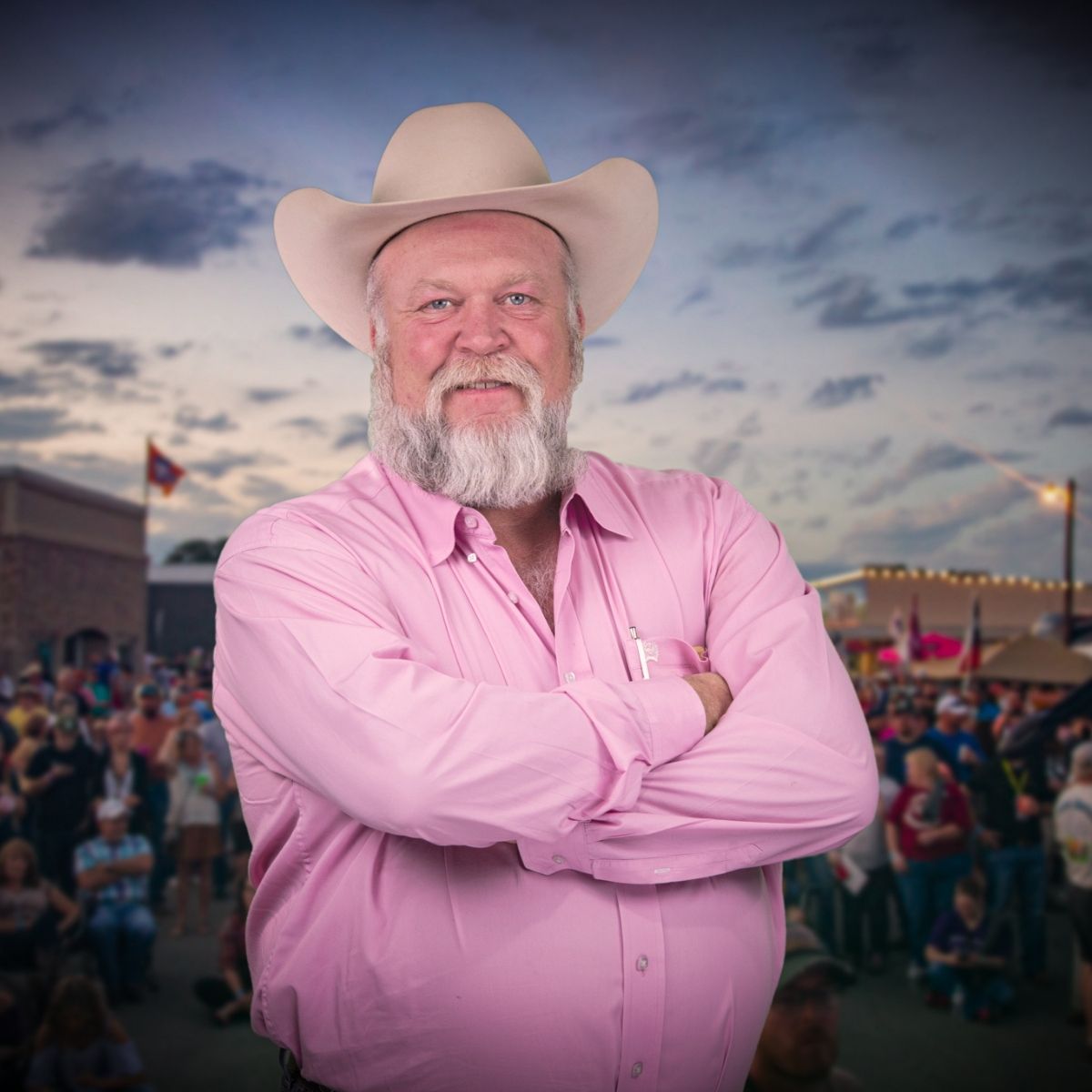 Christie Beyer, Board Member at Bacon Bash Texas with ABF Packing, smiling in a pink blouse at the lively festival gathering.